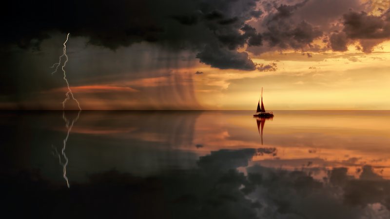 A boat sailing into a storm.